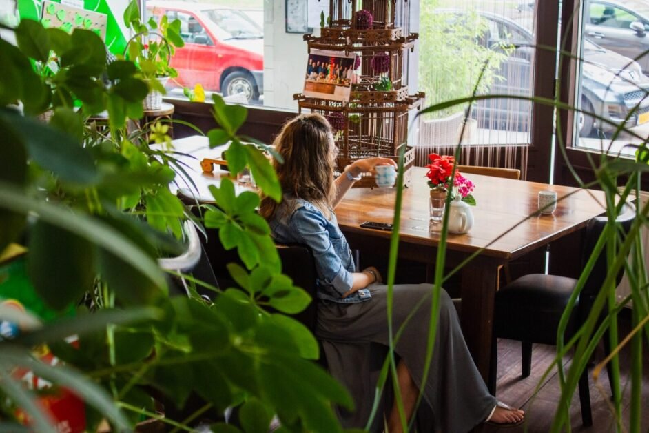 woman sitting near wooden table